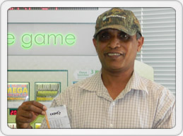Alexandria man smiles with winning ticket